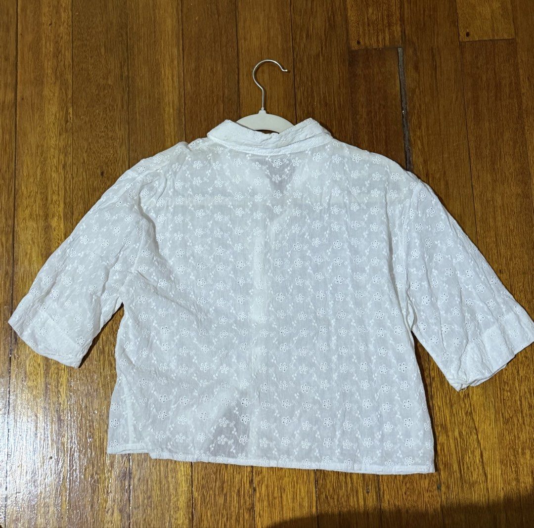Cropped Blouse (Category: Blouses) located in Paranaque City. Submitted by declutternsell.729 (Listing ID 1463774471, Image 3). Description: - Cute white cropped shirt - Features all-over broderie anglaise floral pattern - Collared neckline with button-up front - Short sleeves - Versatile for casual outings or as a beach cover-up BOUGHT IN THAILANS USED ONCE.