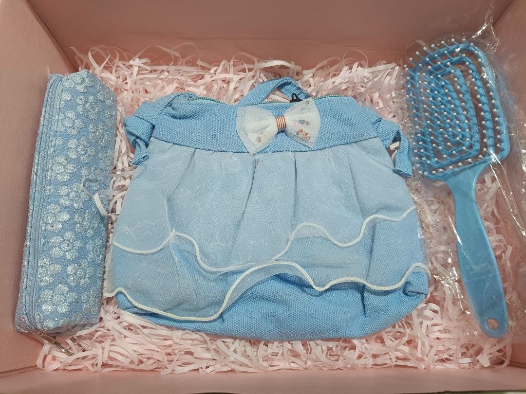 Cute Blue Themed Gift Box with Accessories (Category: Accessory Holder, Box & Organizers) located in Imus. Submitted by mrpp03 (Listing ID 1463930356, Image 2). Description: - Adorable blue themed gift box - Includes: hairbrush, makeup bag, hair ties, steam eye mask - Also comes with a cute notepad and pens - Perfect for gifting or personal treat - Neatly arranged inside Pictures 2 to 5 are all the items included. Items are packed in corrugated b