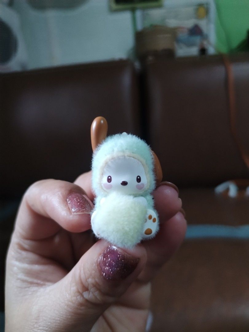Cute Fluffy Doggy Character Figurine (Category: Designer & Blind Box Toys) located in La Trinidad. Submitted by malditas (Listing ID 1463781073, Image 1). Description: - Adorable fluffy doggy character figurine - Wears a light blue hoodie with fluffy trim - Features cute small brown ears - Has a fluffy pom-pom tail - Compact, palm-sized design - Ideal for collectors or as a desk decoration - Makes a great desk buddy From HT box BUY AS IS (NO RETU