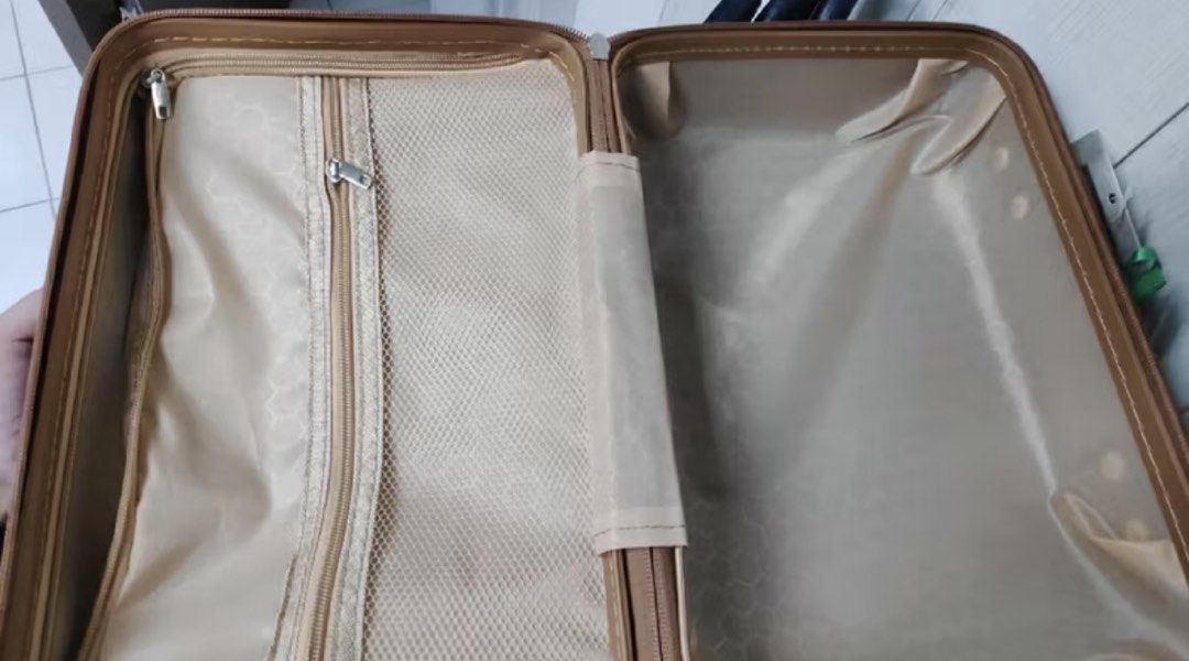Dark Blue and Tan Hard Shell Luggage (Category: Luggage) located in Manila. Submitted by amityclutter (Listing ID 1461938213, Image 2). Description: - Compact hard shell luggage - Dark blue body with tan accents - Ribbed texture on the front - Carry-on size, ideal for short trips - Can also be used as a makeup case - Clean interior, ready for use.