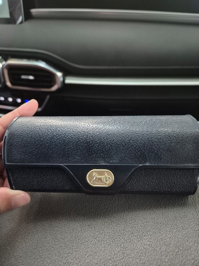 Dark Blue Textured Glasses Case with Gold Emblem (Category: Sunglasses & Eyewear) located in Manila. Submitted by rpaul88 (Listing ID 1463807254, Image 1). Description: - Stylish dark blue textured case for your glasses. - Features an elegant gold emblem on the front. - Secure closure keeps your eyewear safe. - Provides excellent protection for your glasses. - Designed to fit most standard-sized eyeglasses. - Compact and easy to carry wherever yo