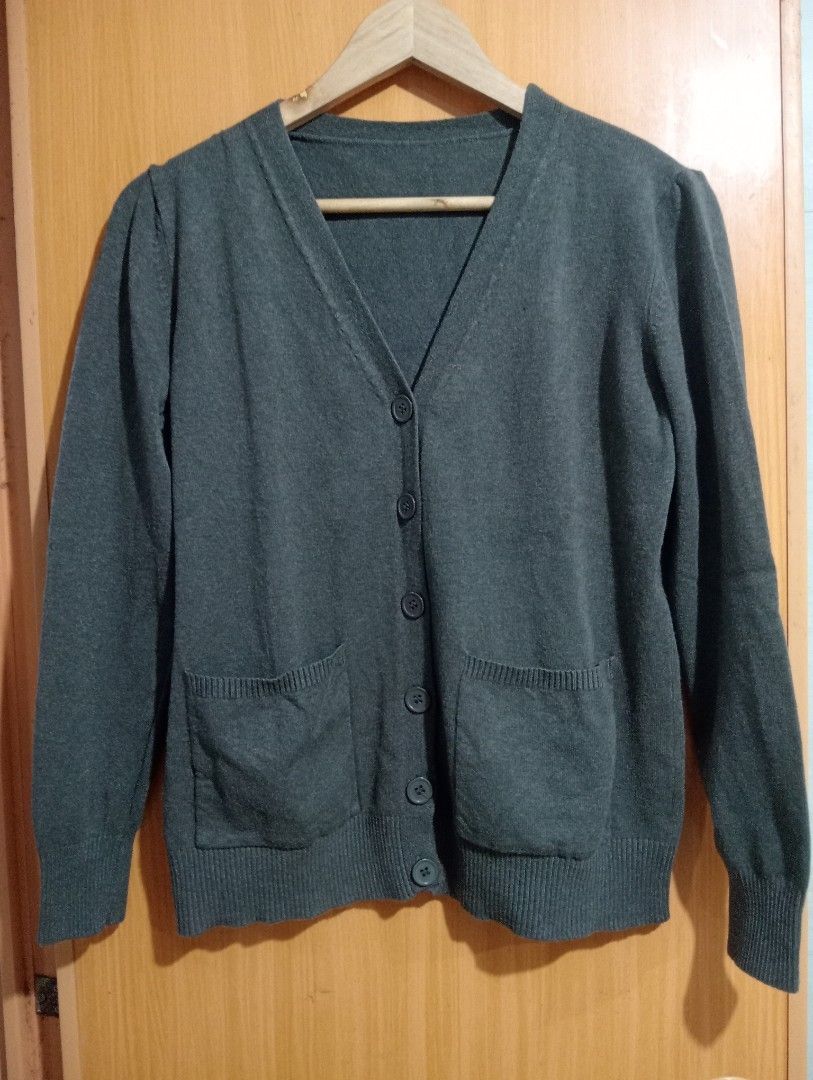 Dark Grey Button-Up Cardigan with Pockets (Category: Coats, Jackets and Outerwear) located in Quezon City. Submitted by niceoutfits (Listing ID 1463742568, Image 3). Description: - Classic dark grey cardigan - V-neckline with button-up front - Two front pockets - Ribbed cuffs and hem - Versatile for layering and various outfits - Easy to match with different tops and bottoms.