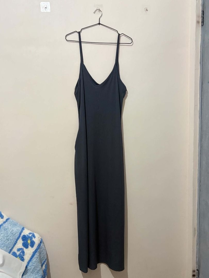 Dark Grey Spaghetti Strap Maxi Dress (Category: Dresses) located in San Leonardo. Submitted by burgossanleonardo.12345 (Listing ID 1463907367, Image 1). Description: - Simple dark grey maxi dress - Features spaghetti straps and a V-neckline - Made from soft, flowy fabric - Ideal for layering or wearing on its own - A versatile piece that can be dressed up or down.