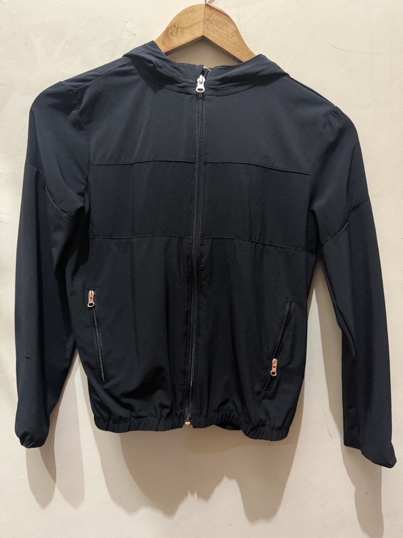 Decathlon Black Hooded Windbreaker Jacket (Category: Coats, Jackets and Outerwear) located in Las Pinas. Submitted by mjm21 (Listing ID 1463849644, Image 1). Description: - Brand: Decathlon - Type: Hooded Windbreaker Jacket - Color: Black - Size: 10-11 years - Closure: Full zip front - Pockets: Two zip pockets - Features: Elasticated cuffs and hem - Origin: Made in Bangladesh - Ideal for: Outdoor activities, everyday wear.