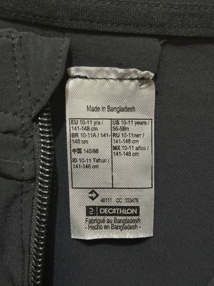 Decathlon Black Hooded Windbreaker Jacket (Category: Coats, Jackets and Outerwear) located in Las Pinas. Submitted by mjm21 (Listing ID 1463849644, Image 3). Description: - Brand: Decathlon - Type: Hooded Windbreaker Jacket - Color: Black - Size: 10-11 years - Closure: Full zip front - Pockets: Two zip pockets - Features: Elasticated cuffs and hem - Origin: Made in Bangladesh - Ideal for: Outdoor activities, everyday wear.