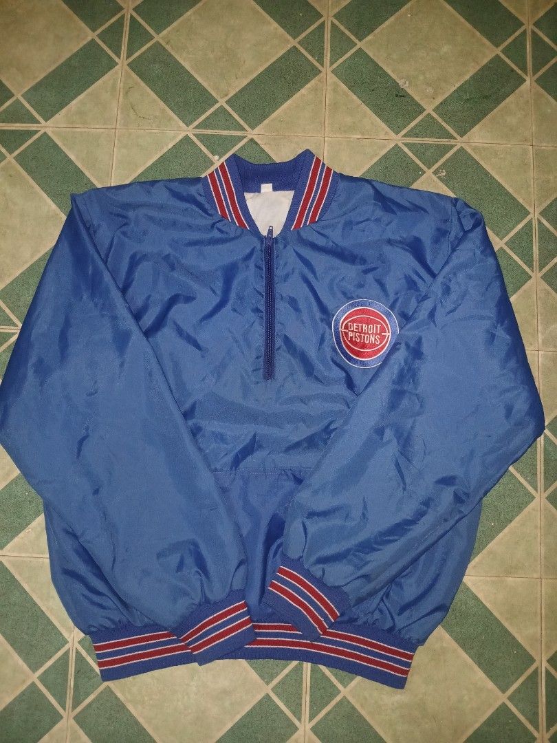 Detroit Pistons Blue Windbreaker Jacket (Category: Coats, Jackets and Outerwear) located in Pateros City. Submitted by m4ry.b0o (Listing ID 1463885031, Image 1). Description: - Blue Detroit Pistons jacket - Quarter zip with white collar lining - Ribbed cuffs and hem with red and white stripes - Ideal for Detroit Pistons fans - Great for cooler weather.