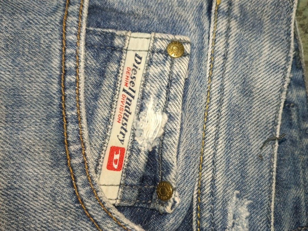 Diesel & Polo Ralph Lauren Pants Bundle (Category: Jeans) located in Carcar. Submitted by rolandobac92675 (Listing ID 1463782999, Image 2). Description: - Bundle includes: 1 pair Diesel denim jeans with distressed details and dragon embroidery on back pockets. - Also includes: 1 pair navy blue Polo Ralph Lauren stretch slim fit chinos. - Both items are excellent additions to any wardrobe. - Please check photos for detailed condition..