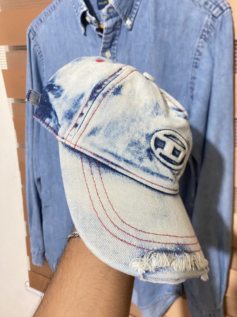 Diesel Denim Acid Wash Baseball Cap (Category: Caps & Hats) located in Quezon City. Submitted by dawnduethrift (Listing ID 1463918471, Image 2). Description: - Acid wash denim Diesel cap - Red stitching details - Distressed edges on brim - Bright pink lining inside - Perfect for casual outfits.