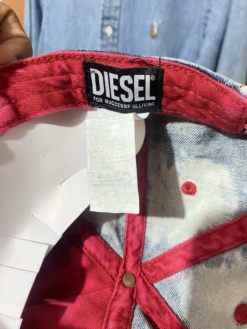 Diesel Denim Acid Wash Baseball Cap (Category: Caps & Hats) located in Quezon City. Submitted by dawnduethrift (Listing ID 1463918471, Image 3). Description: - Acid wash denim Diesel cap - Red stitching details - Distressed edges on brim - Bright pink lining inside - Perfect for casual outfits.
