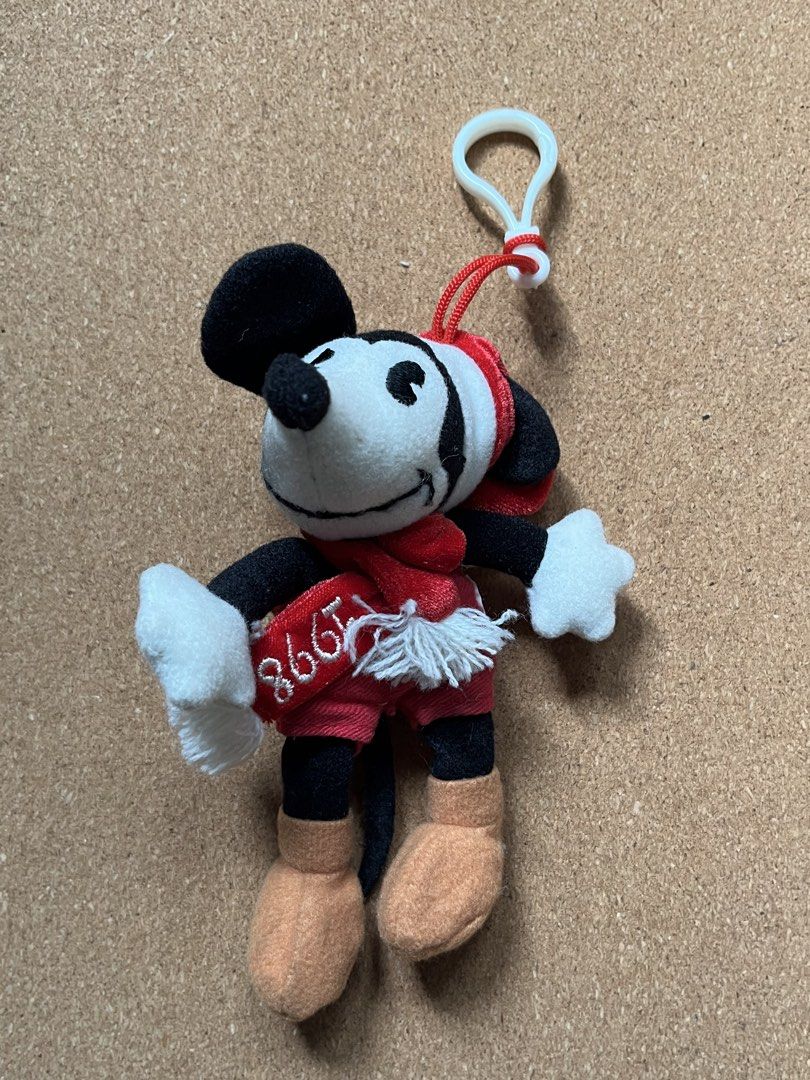 Disney Mickey Mouse 1998 Plush Keychain (Category: Plushies & Soft Toys) located in Baguio. Submitted by gaara1234 (Listing ID 1463749007, Image 1). Description: - Adorable Mickey Mouse plush keychain - From 1998, a true vintage find! - Features classic red shorts and a red scarf - Comes with a white clip for easy attachment to bags or keys - A must-have collectible for any Disney fan - Small and portable, perfect for on-the-go display.