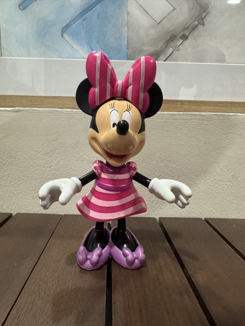 Disney Minnie Mouse Figurine Toy (Category: Figurines & Statues) located in Quezon City. Submitted by kcapi (Listing ID 1461954553, Image 1). Description: - Adorable Minnie Mouse figurine - Features a cute pink dres, bow and purple shoes - Perfect for Disney enthusiasts and collectors - Stands independently, ideal for display - Suitable for both play and decoration.