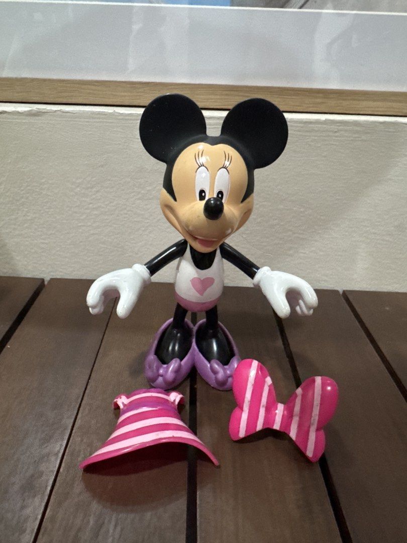 Disney Minnie Mouse Figurine Toy (Category: Figurines & Statues) located in Quezon City. Submitted by kcapi (Listing ID 1461954553, Image 2). Description: - Adorable Minnie Mouse figurine - Features a cute pink dres, bow and purple shoes - Perfect for Disney enthusiasts and collectors - Stands independently, ideal for display - Suitable for both play and decoration.