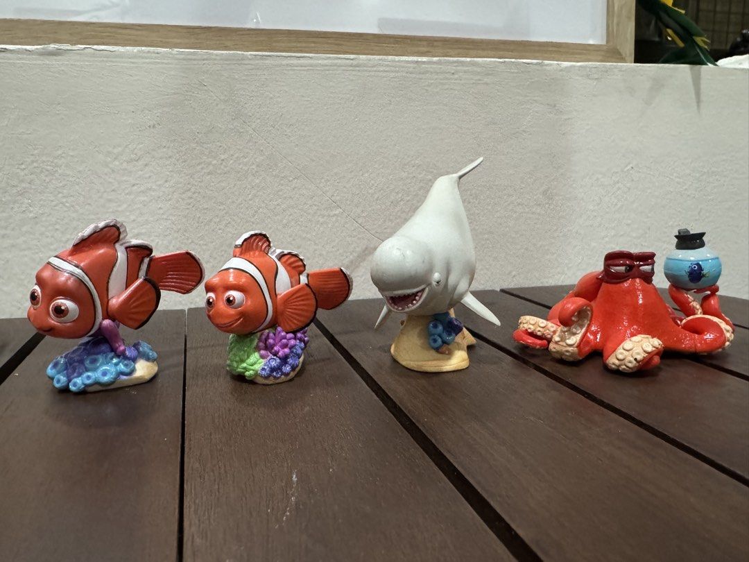 Disney Pixar Finding Nemo & Dory Character Figurines Set (Category: Figurines & Statues) located in Quezon City. Submitted by kcapi (Listing ID 1463878067, Image 3). Description: - Set of 6 Finding Nemo and Dory character figurines. - Includes Nemo, Dory, Marlin, Bruce the shark, Destiny the whale shark, and Hank the octopus. - Ideal for collectors or fans of the movies. - Perfect for display on desks or shelves. - Each figurine stands on a small