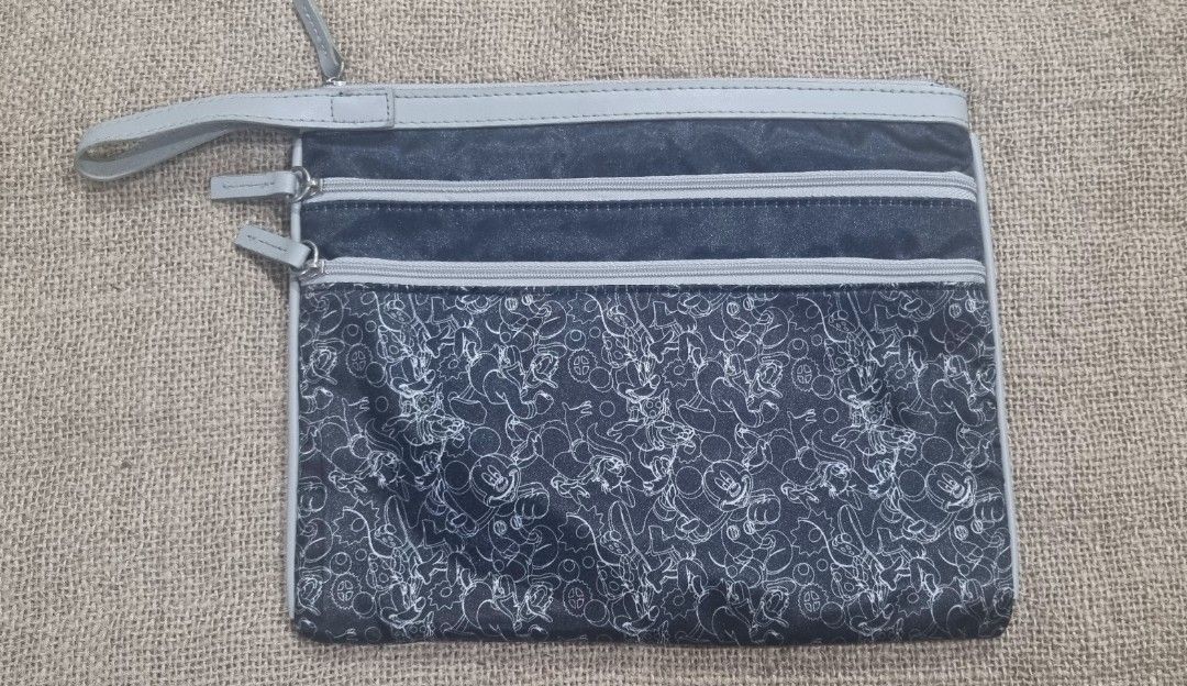 Disney pouch (Category: Purses & Pouches) located in San Jose del Monte. Submitted by angelsnest (Listing ID 1463828711, Image 1). Description: With signs of usage Needs wash 10"W x 8"L rfs: decluterring Gcash, Maya, Bank transfer No COD available.