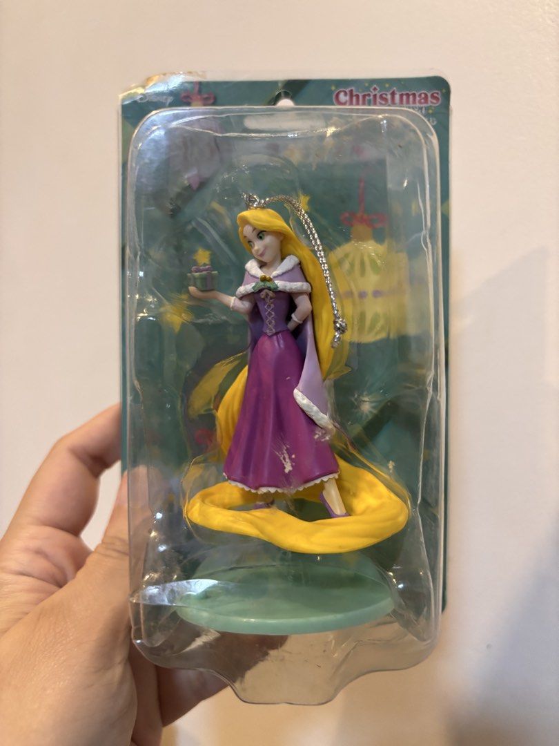 Disney Rapunzel Christmas Ornament (Category: Figurines & Statues) located in Quezon City. Submitted by onlinebazaare (Listing ID 1463749871, Image 1). Description: - Rapunzel Christmas ornament - Comes in original packaging - Rapunzel is holding a small gift - Ideal for Disney fans and holiday decor - Add Disney magic to your Christmas tree!.