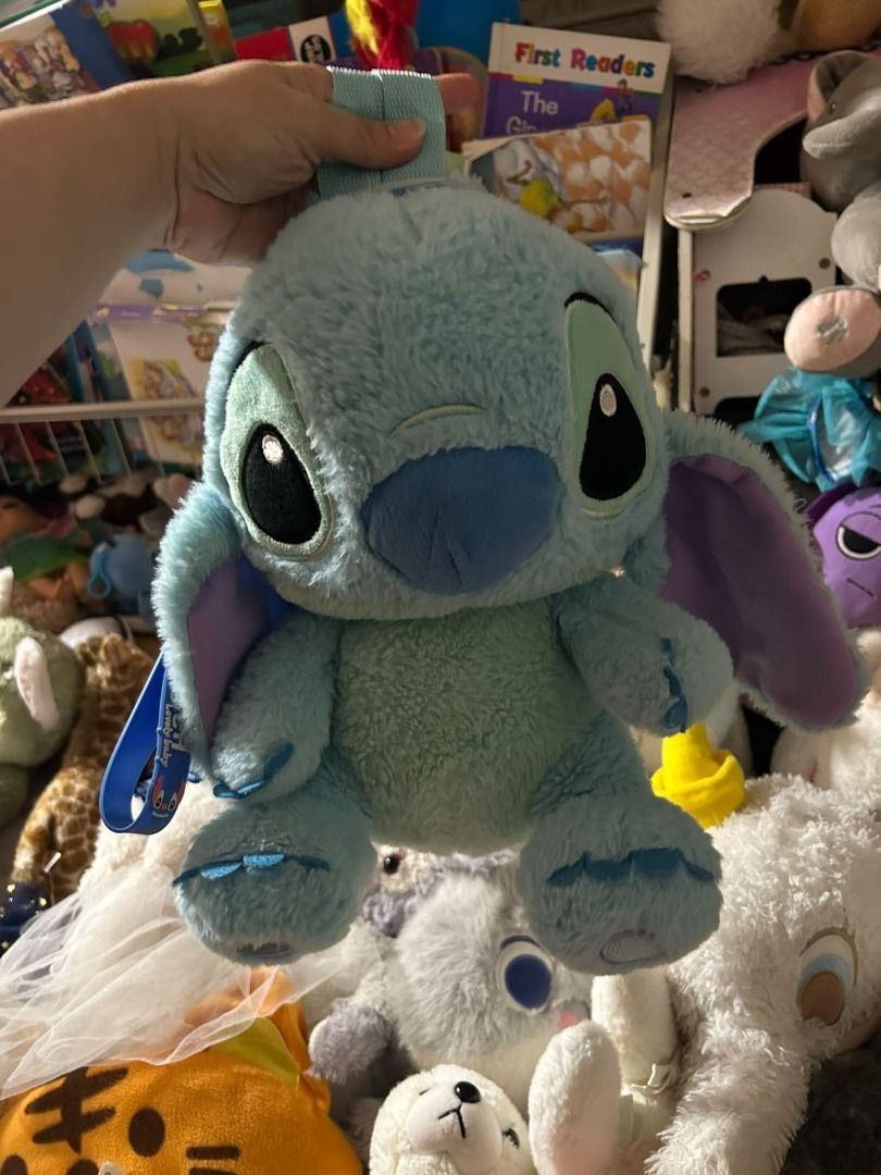 Disney Stitch Plush Backpack with free Keychain (Category: Plushies & Soft Toys) located in Las Pinas. Submitted by whatzupriley (Listing ID 1463861633, Image 3). Description: 💙 Stitch Plush Backpack Cute and cuddly Stitch plush backpack 💙 Perfect for kids, Stitch fans, or collectors! 📌 CONDITION / ISSUE: ⚠️ The top carrying strap has been cut/damaged — please see photos. The strap will need to be repaired or reattached if you want to use it a