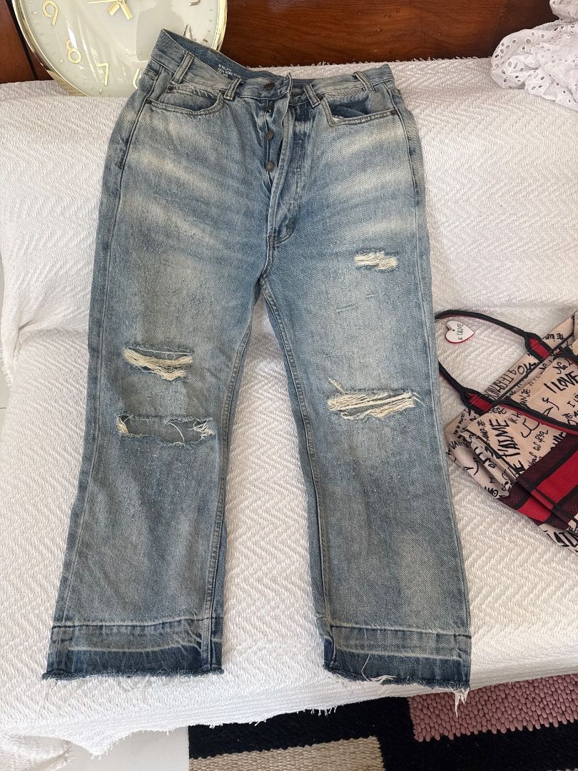 Distressed Light Wash Denim Jeans (Category: Jeans) located in Makati City. Submitted by eskarina62 (Listing ID 1463793493, Image 1). Description: - Light wash denim jeans - Distressed look with rips on knees and thighs - Button fly closure - Wide leg opening with raw hem - Unique textured pattern throughout - Ideal for a casual, edgy style Measurements Waist 15 Depth 13/16 Hips 21 Length-39 Width of leg 11/8 Measurements are in inches .