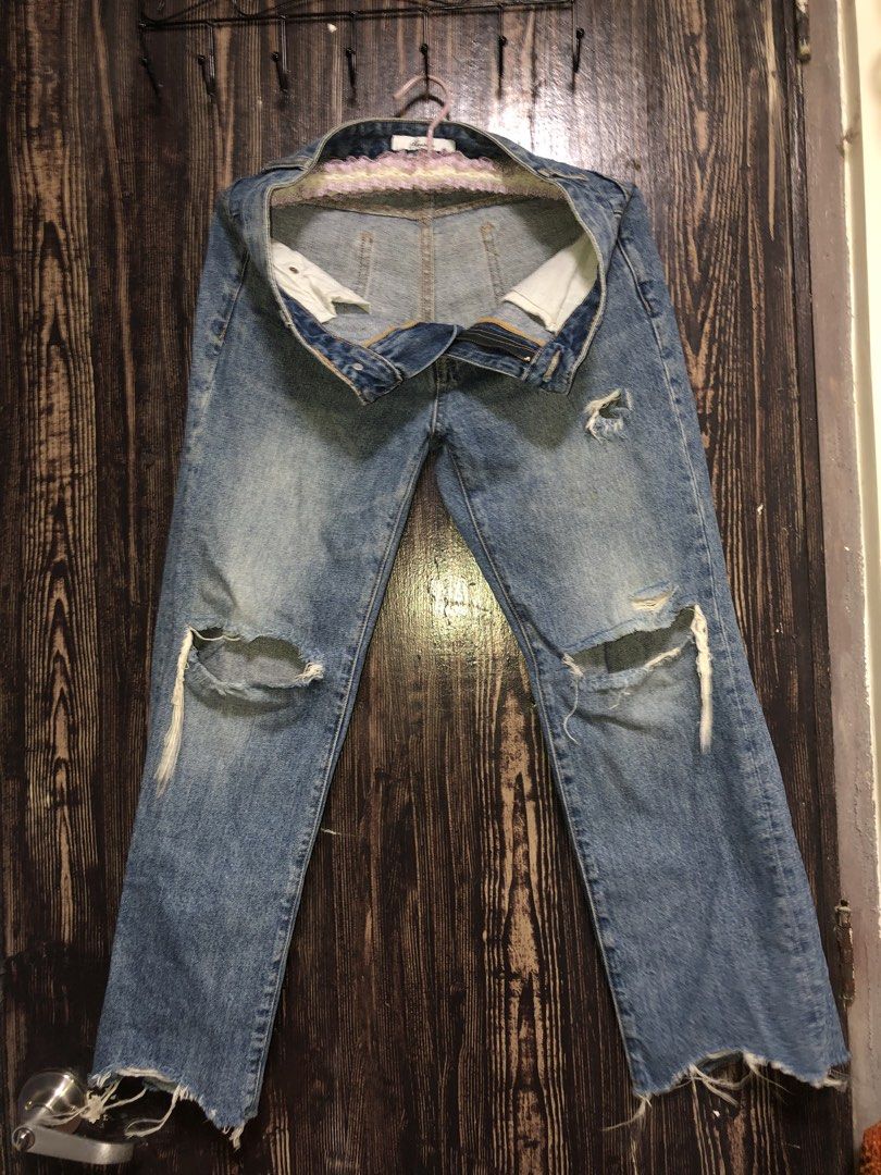 Distressed Ripped Jeans (Category: Jeans) located in Manila. Submitted by zhala_dawn3 (Listing ID 1463746372, Image 1). Description: Cool light wash denim jeans with ripped knees and frayed hems. Straight leg, perfect for everyday casual style..