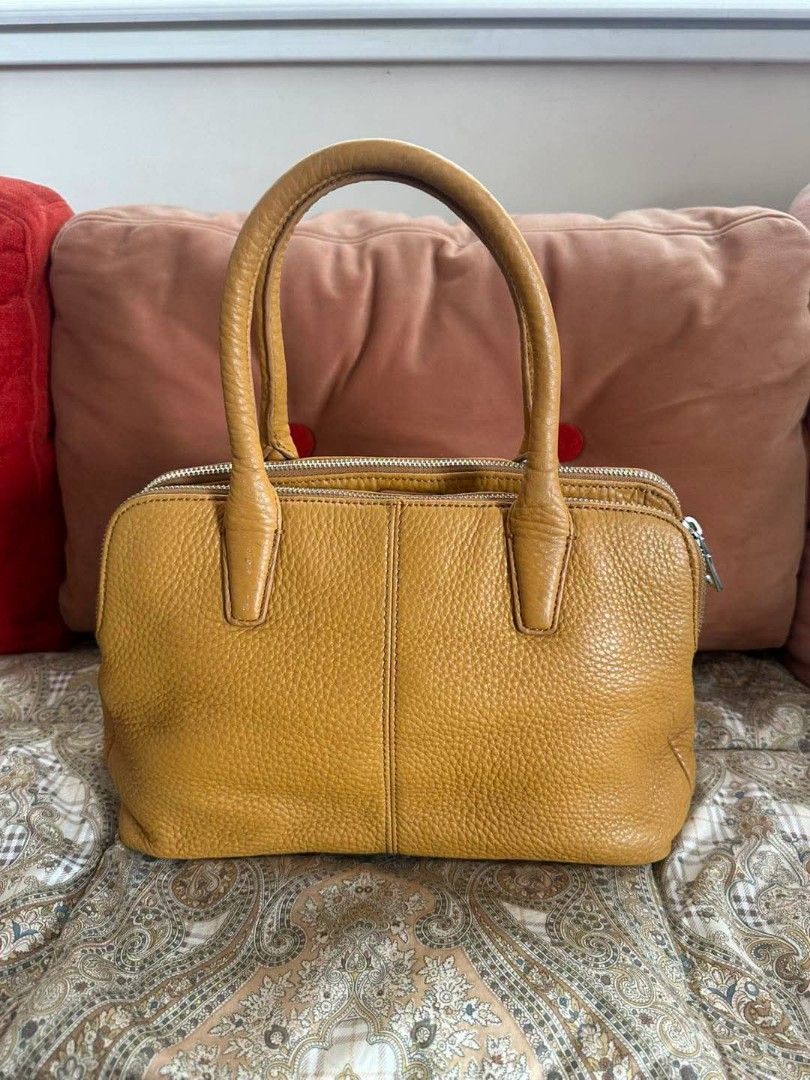 DKNY Double Zip Pebbled Leather Bag (Category: Luxury Bags & Wallets) located in Quezon City. Submitted by dannikkishoppe2 (Listing ID 1463862470, Image 3). Description: DKNY Double Zip Pebbled Leather Bag ‼️₱3500‼️ *genuine leather (mustard) *3 compartment design *good as new W12in x D6in x H8in Handle drop 7in.