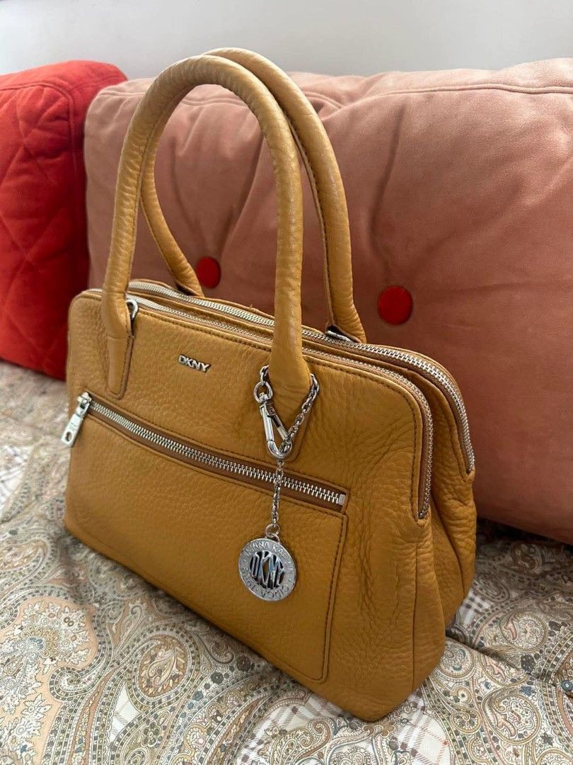 DKNY Double Zip Pebbled Leather Bag (Category: Luxury Bags & Wallets) located in Quezon City. Submitted by dannikkishoppe2 (Listing ID 1463862470, Image 2). Description: DKNY Double Zip Pebbled Leather Bag ‼️₱3500‼️ *genuine leather (mustard) *3 compartment design *good as new W12in x D6in x H8in Handle drop 7in.