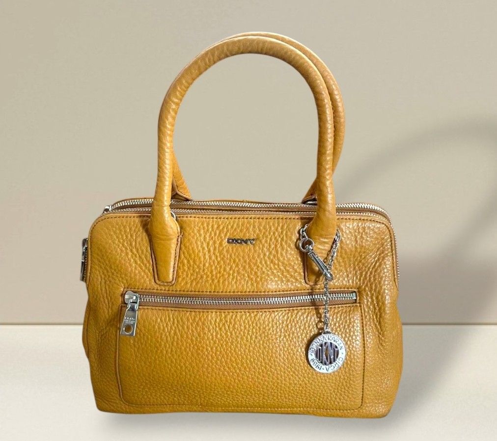 DKNY Double Zip Pebbled Leather Bag (Category: Luxury Bags & Wallets) located in Quezon City. Submitted by dannikkishoppe2 (Listing ID 1463862470, Image 1). Description: DKNY Double Zip Pebbled Leather Bag ‼️₱3500‼️ *genuine leather (mustard) *3 compartment design *good as new W12in x D6in x H8in Handle drop 7in.