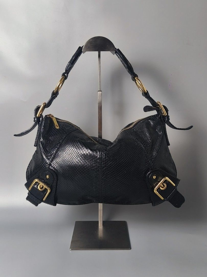 Dolce & Gabbana Embossed Shoulder Bag (Category: Luxury Bags & Wallets) located in Bulacan. Submitted by 4kcollection (Listing ID 1463747389, Image 1). Description: Dolce & Gabbana Embossed Shoulder Bag (RARE) Pre-loved from Japan Very Good Condition Exotic Python Skin 💯 Lampo Zip Sign of Usage Dm for sure buyer 📩 MOP: Gcash / Maya / BPI Courier: J&t / Lbc / Lalamove Location: SJDM Bulacan.