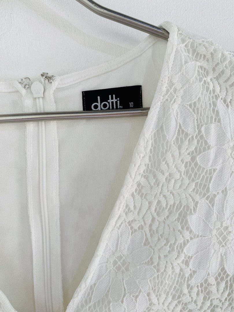 Dotti White Lace Wrap Romper (Category: Rompers) located in Vigan. Submitted by yourcloset1001 (Listing ID 1463912611, Image 3). Description: - Dotti white lace romper - Size 10 - Wrap front design - Flutter sleeves - Tiered ruffled hem - Tie detail at the back - Ideal for events or a night out.