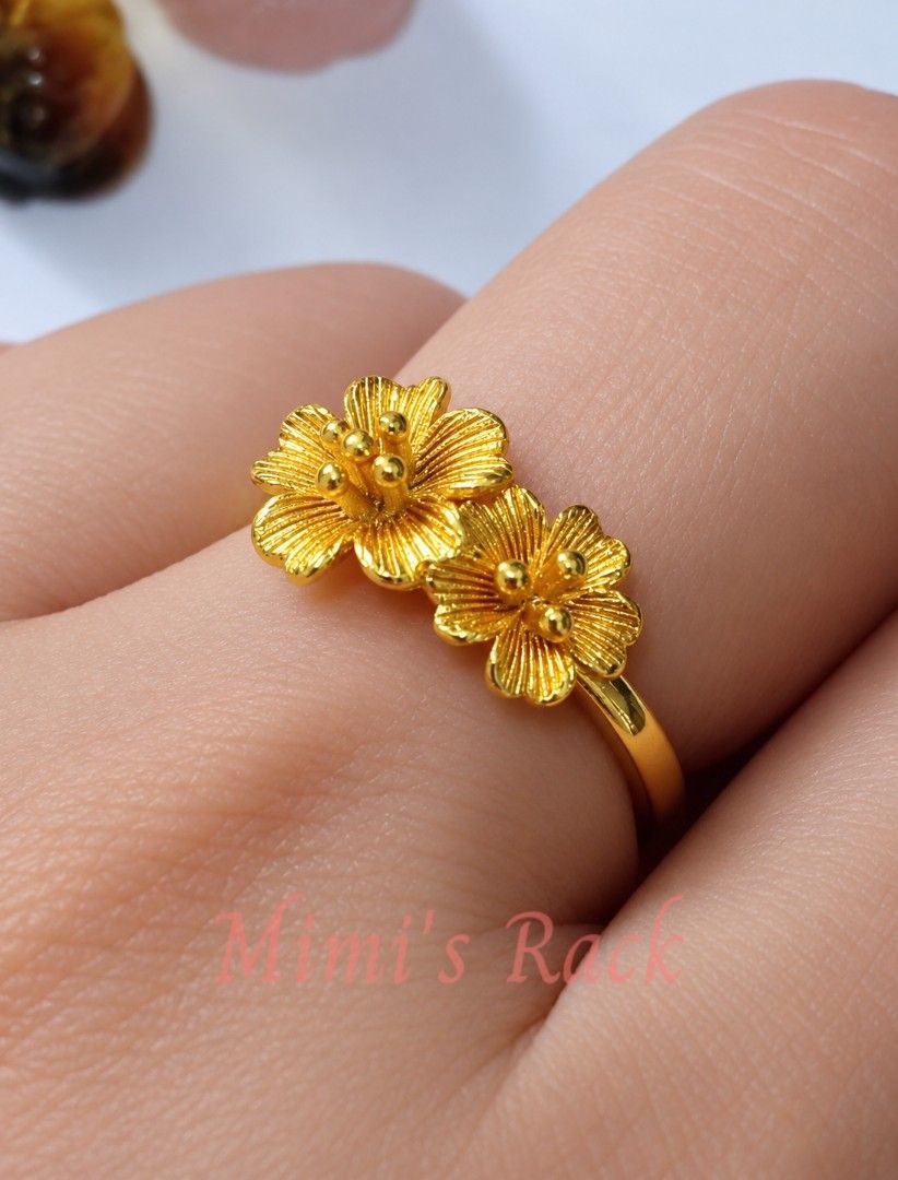 Double Sakura Flower Adjustable Ring | Gold Tone Floral Ring (Category: Rings) located in Taguig. Submitted by mimisrack (Listing ID 1463810273, Image 1). Description: 💛A delicate double sakura ring that adds a touch of elegance and femininity to any outfit. -Features two detailed sakura (cherry blossom) flowers -Adjustable open-band design fits most finger sizes -In Japanese culture, sakura blossoms symbolize beauty, renewal, hope, and the flee