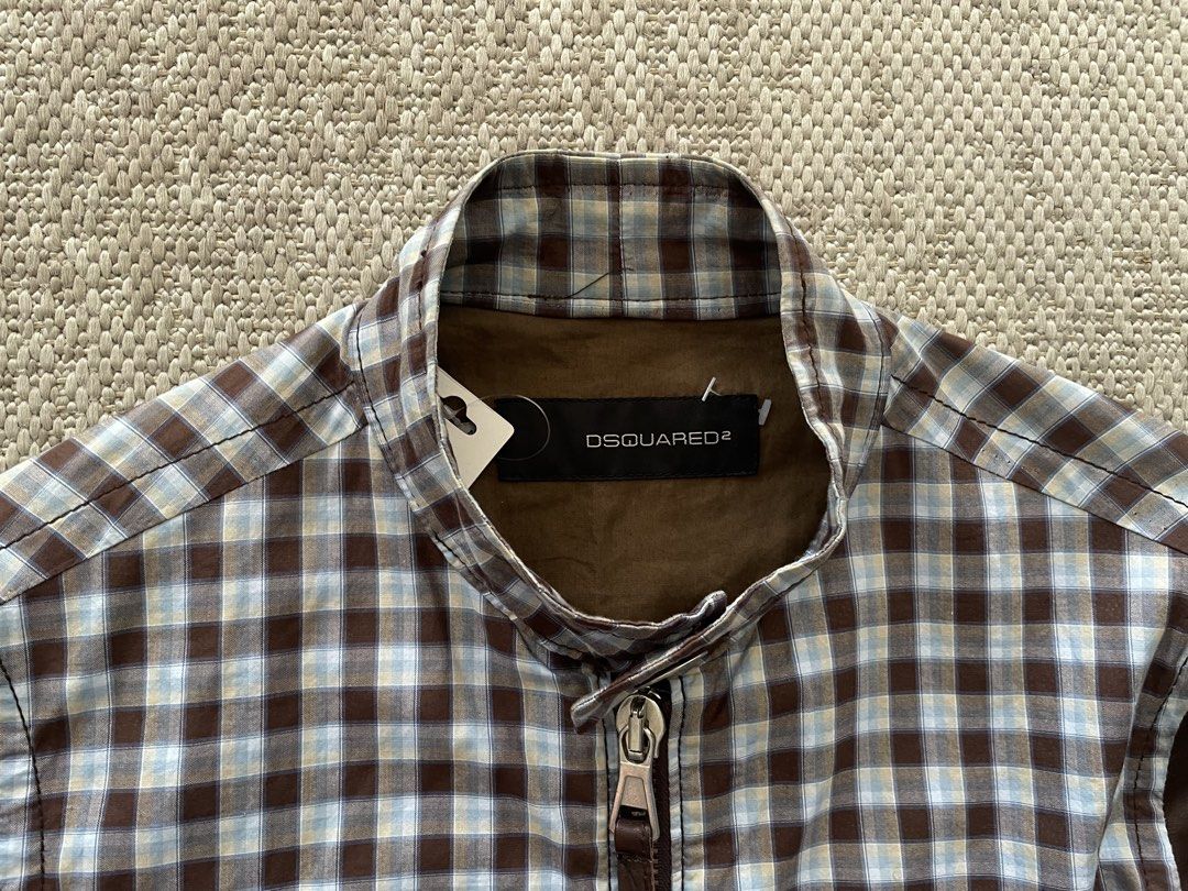 DSQUARED2 Bomber Jacket Plaid Body Leather Sleeves (Category: Coats, Jackets and Outerwear) located in Manila. Submitted by rei.ocn (Listing ID 1463845968, Image 3). Description: - Brand: DSQUARED2 - Style: Bomber Jacket - Body: Plaid fabric - Sleeves: Brown leather - Closure: Zip-up front - Pockets: Two front pockets - Detail: 'Dan' embroidery on chest - Occasion: Casual wear.