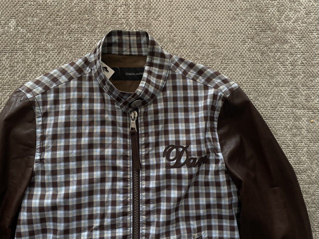 DSQUARED2 Bomber Jacket Plaid Body Leather Sleeves (Category: Coats, Jackets and Outerwear) located in Manila. Submitted by rei.ocn (Listing ID 1463845968, Image 2). Description: - Brand: DSQUARED2 - Style: Bomber Jacket - Body: Plaid fabric - Sleeves: Brown leather - Closure: Zip-up front - Pockets: Two front pockets - Detail: 'Dan' embroidery on chest - Occasion: Casual wear.