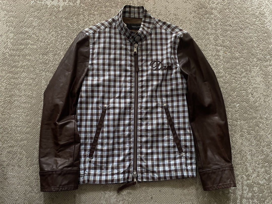 DSQUARED2 Bomber Jacket Plaid Body Leather Sleeves (Category: Coats, Jackets and Outerwear) located in Manila. Submitted by rei.ocn (Listing ID 1463845968, Image 1). Description: - Brand: DSQUARED2 - Style: Bomber Jacket - Body: Plaid fabric - Sleeves: Brown leather - Closure: Zip-up front - Pockets: Two front pockets - Detail: 'Dan' embroidery on chest - Occasion: Casual wear.