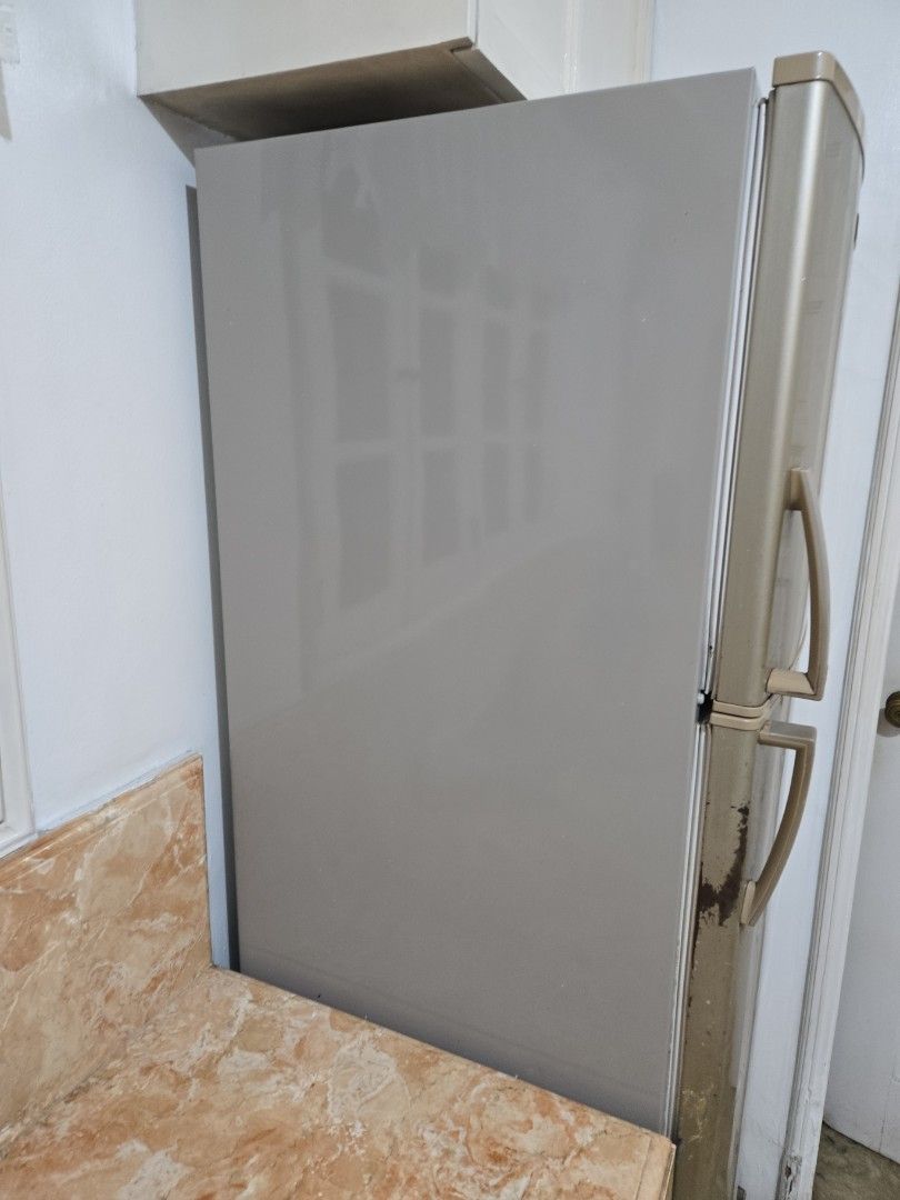 Electrolux Refrigerator (Category: Refrigerators and Freezers) located in Makati City. Submitted by cool1990 (Listing ID 1463770221, Image 2). Description: - Electrolux Refrigerator - Two Doors (Top Freezer) - Silver Finish - Visible marks/dirt on lower right door and handle area - Otherwise in decent condition.