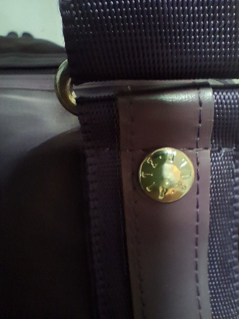 ELLE Purple Nylon Duffle Bag with Shoulder Strap (Category: Shoulder Bags) located in Angeles City. Submitted by anneps (Listing ID 1463831434, Image 2). Description: - Brand: ELLE - Color: Purple - Material: Nylon with leather accents - Features: Detachable shoulder strap, top handles, zipper closure - Interior detail: 'MADE IN KOREA' tag - Ideal for: Travel, gym.