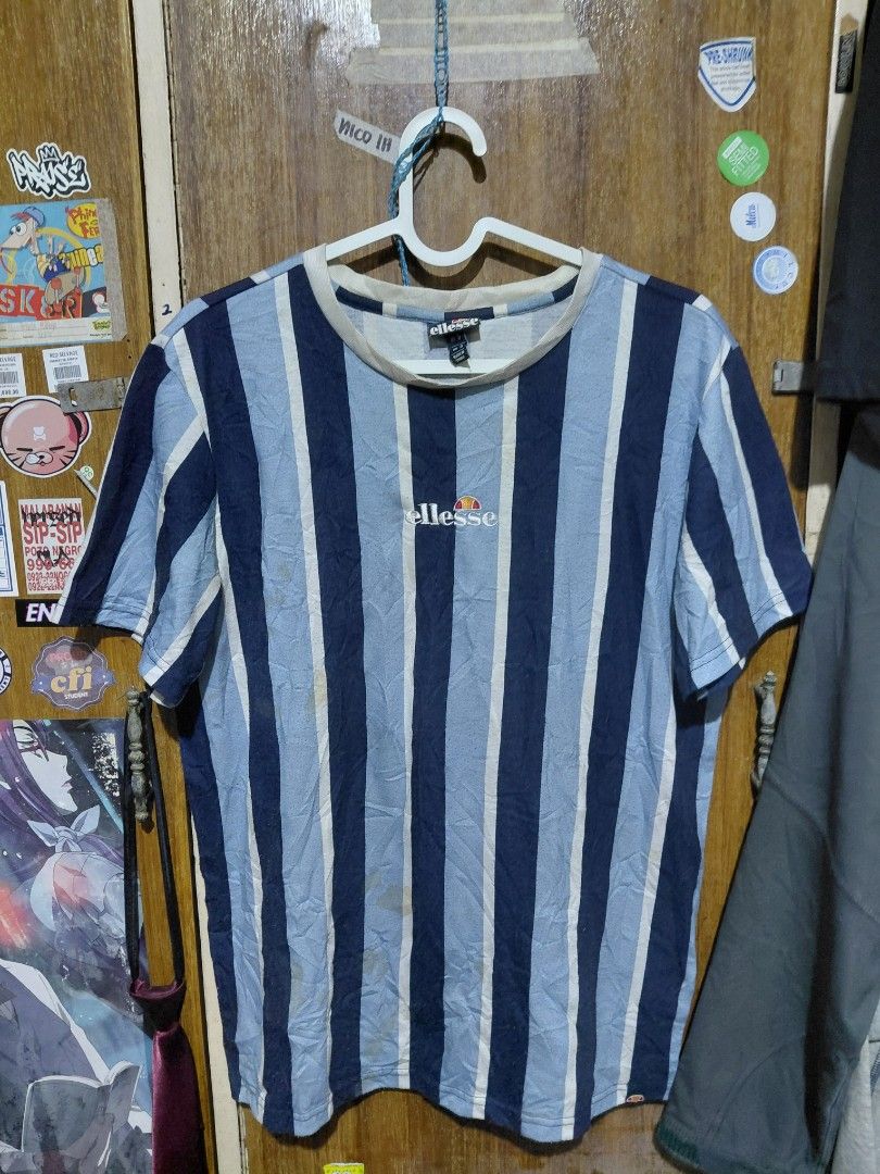 Ellesse Striped T-Shirt (Category: Shirts) located in Imus. Submitted by frootiloots4103 (Listing ID 1463753850, Image 1). Description: - Ellesse blue and white striped t-shirt - Size S (UK) - Ideal for casual wear washable stain OPEN FOR NEGO (best if aspack) 📍Imus, Cavite 4103 Can do meetups within Imus Area 🚚 J&T or Lalamove 📨 DMs are OPEN 💸 Cash | GCash | BDO | Maribank kindly follow us on IG @frootiloots.