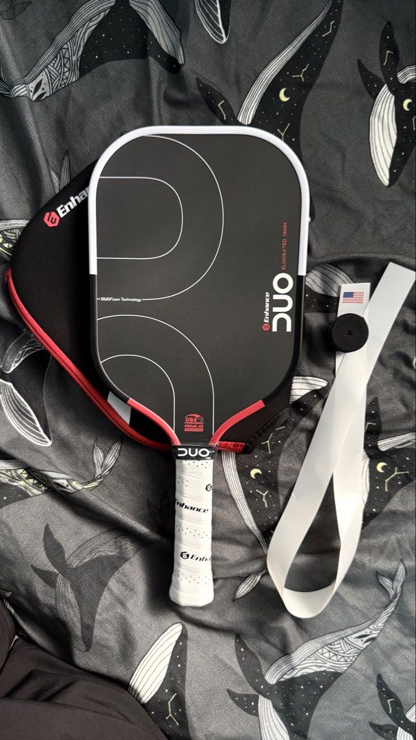 Enhance DUO Pickleball Paddle (Category: Racket and Ball Sports) located in Manila. Submitted by leanced17 (Listing ID 1463935175, Image 2). Description: For sale: - Brand new Enhance DUO Pickleball Paddle. - 16mm Elongated. - With free edge guard and over grip. RFS: Extra paddle. Price is 9,500. Negotiable for sure buyer. 📍Pampanga, Bulacan, Metro Manila..