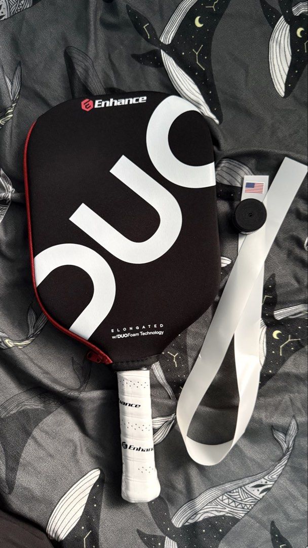Enhance DUO Pickleball Paddle (Category: Racket and Ball Sports) located in Manila. Submitted by leanced17 (Listing ID 1463935175, Image 1). Description: For sale: - Brand new Enhance DUO Pickleball Paddle. - 16mm Elongated. - With free edge guard and over grip. RFS: Extra paddle. Price is 9,500. Negotiable for sure buyer. 📍Pampanga, Bulacan, Metro Manila..