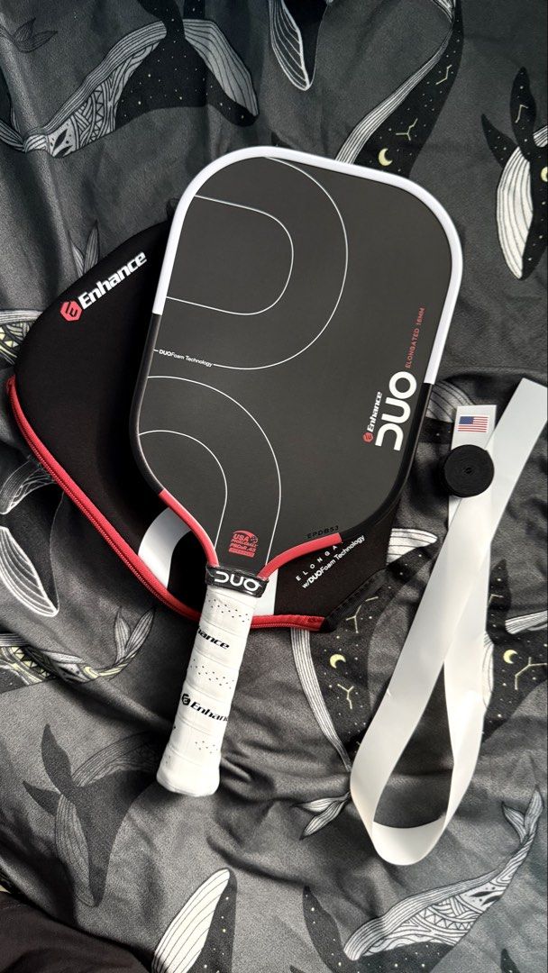 Enhance DUO Pickleball Paddle (Category: Racket and Ball Sports) located in Manila. Submitted by leanced17 (Listing ID 1463935175, Image 3). Description: For sale: - Brand new Enhance DUO Pickleball Paddle. - 16mm Elongated. - With free edge guard and over grip. RFS: Extra paddle. Price is 9,500. Negotiable for sure buyer. 📍Pampanga, Bulacan, Metro Manila..