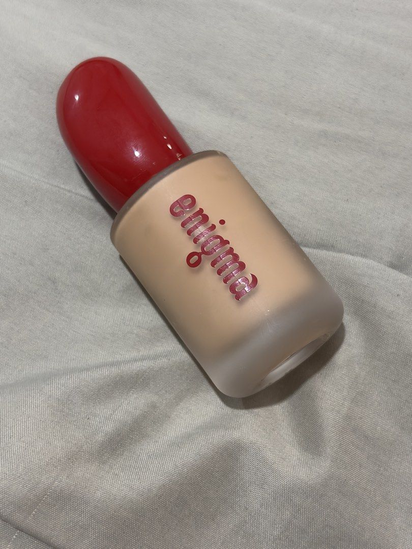 Enigma Foundation MN12 (Category: Makeup) located in Cabuyao City. Submitted by benerbo (Listing ID 1463789171, Image 1). Description: - Enigma foundation - Frosted glass bottle with bright red cap - Shade: Light to medium skin tone - Ideal for everyday wear - Reason for selling: Incorrect shade match for seller.