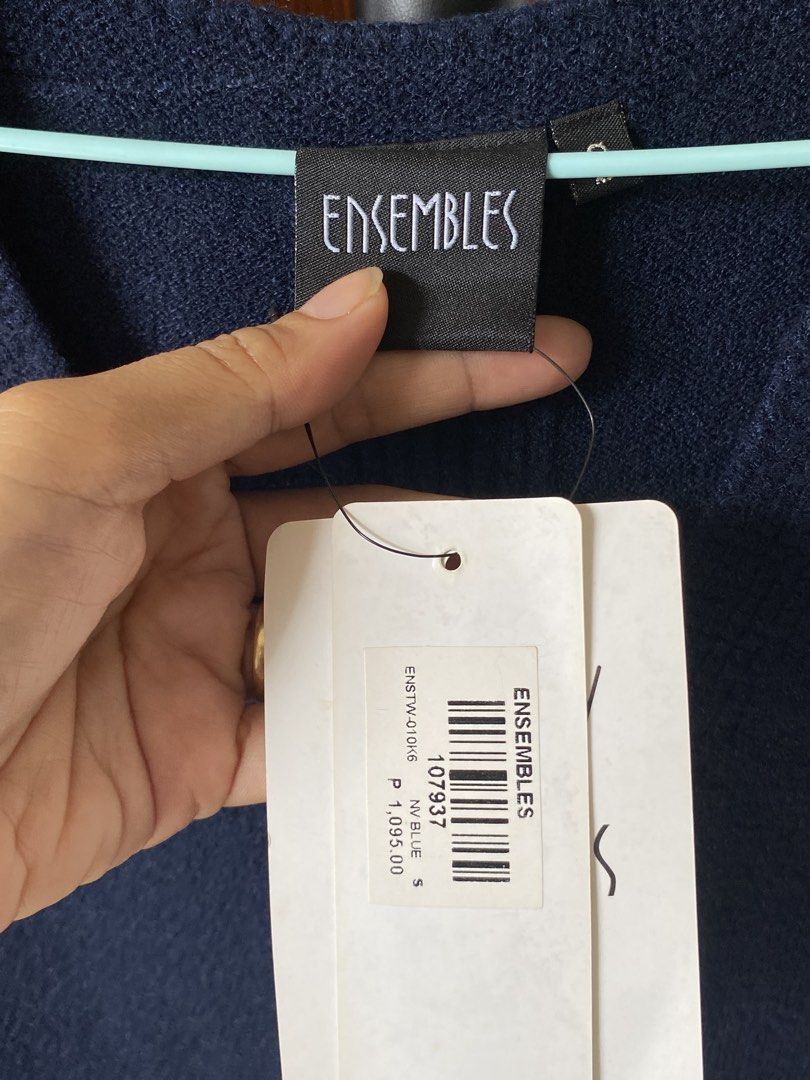 Ensembles Navy Blue V-Neck Knit Vest (Category: Sleeveless) located in Santa Rosa. Submitted by hoardqueensdeclutter (Listing ID 1463796480, Image 2). Description: - Brand: Ensembles - Color: Navy Blue - Style: Knit Vest - Features: V-neck, side slits, ribbed hem and neckline - Estimated Size: S - Condition: Brand new with original tags attached.