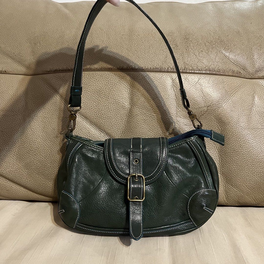 ESTINE Dark Green Leather Shoulder Bag (Category: Shoulder Bags) located in Calamba. Submitted by jupreloved_ (Listing ID 1463765415, Image 1). Description: Dark green ESTINE leather shoulder bag. Features front buckle flap, top zip, and back zip pocket. Interior zip and slip pockets. Brand: Estine Size: Small Shipping through J&T. Payment are strictly through GCASH only, no COD. Exact size and color may be different from the picture. This is a p