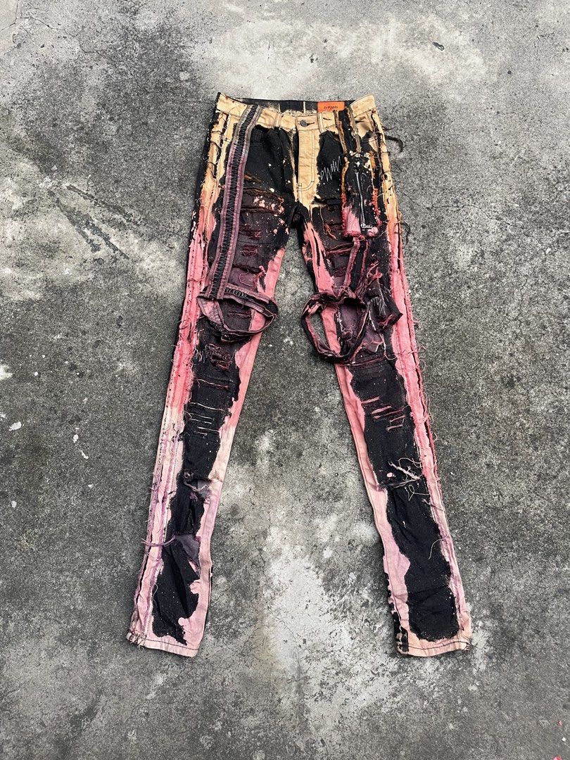 EV BRAVADO Distressed Bleached Denim Jeans (Category: Jeans) located in Pasay City. Submitted by qptingz (Listing ID 1463834987, Image 1). Description: - 2024 LVMH finalist EV BRAVADO - Unique distressed and bleached design - Black denim with pink and orange accents - Heavy distressing, rips, and frayed edges - Zipper fly with button closure - Ideal streetwear piece - Please check photos for detailed condition.
