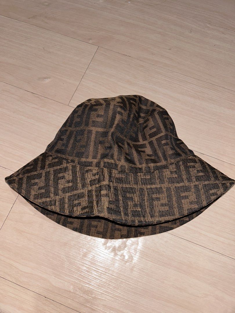 Fendi FF Monogram Bucket Hat Brown (Category: Caps & Hats) located in Dipolog. Submitted by adrian281994 (Listing ID 1463839174, Image 2). Description: - Classic Fendi bucket hat - Features iconic FF monogram pattern - Color: Brown and black - Made in Italy - Care: Professional clean only - Perfect accessory to elevate any outfit.