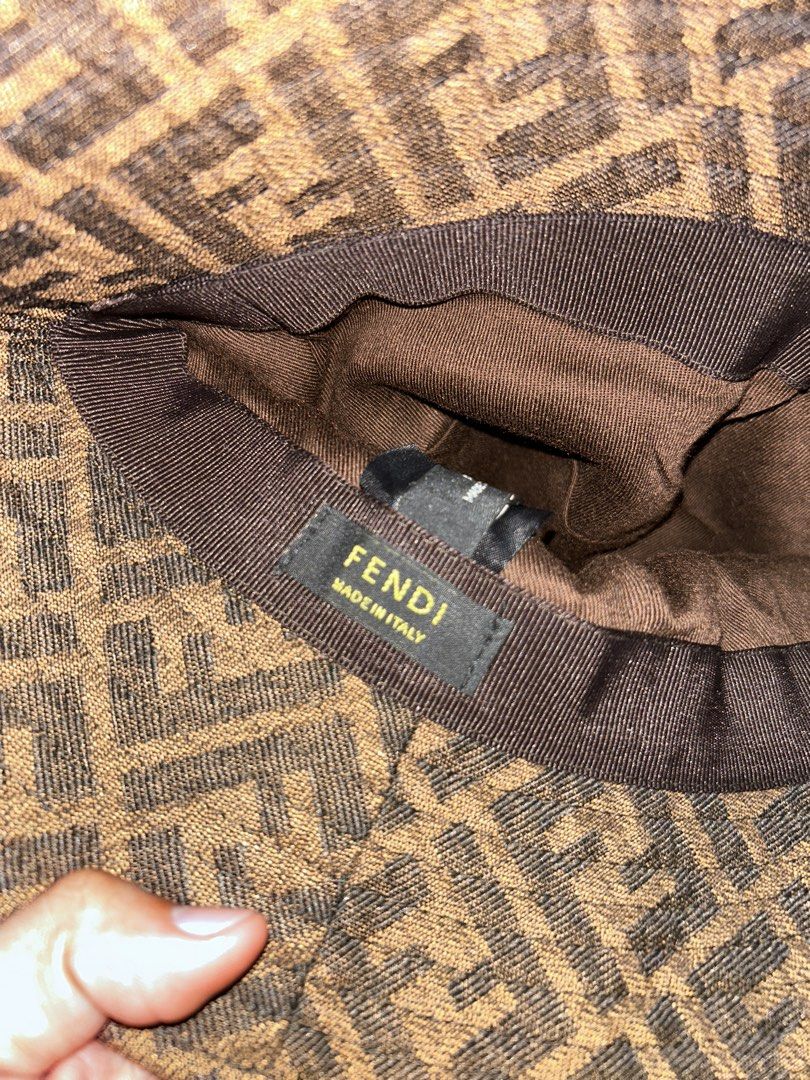 Fendi FF Monogram Bucket Hat Brown (Category: Caps & Hats) located in Dipolog. Submitted by adrian281994 (Listing ID 1463839174, Image 3). Description: - Classic Fendi bucket hat - Features iconic FF monogram pattern - Color: Brown and black - Made in Italy - Care: Professional clean only - Perfect accessory to elevate any outfit.