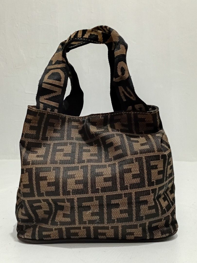 Fendi Zucca Mini Bag (Category: Luxury Bags & Wallets) located in Navotas City. Submitted by ms.soulana (Listing ID 1463859486, Image 2). Description: PreOwned lightly Used WellUsed Fendi Zucca mini Boston bag - Classic brown and black Zucca print - Small size, ideal for essentials - Features top handles for carrying - A charming vintage addition to your collection Sign of Used inside ng bag Off /Legit No guaranty sa Authenticity - Please check p