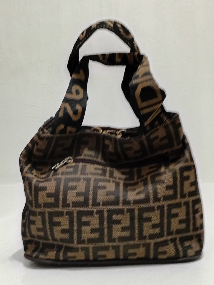 Fendi Zucca Mini Bag (Category: Luxury Bags & Wallets) located in Navotas City. Submitted by ms.soulana (Listing ID 1463859486, Image 3). Description: PreOwned lightly Used WellUsed Fendi Zucca mini Boston bag - Classic brown and black Zucca print - Small size, ideal for essentials - Features top handles for carrying - A charming vintage addition to your collection Sign of Used inside ng bag Off /Legit No guaranty sa Authenticity - Please check p