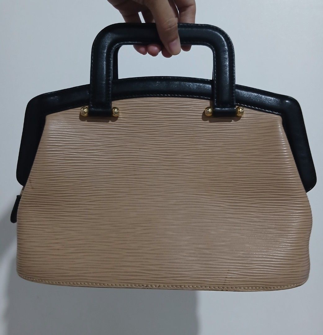 Fendi Zucca Monogram Canvas & Leather Handbag (Category: Luxury Bags & Wallets) located in Alaminos. Submitted by sachiKaSan (Listing ID 1463866277, Image 2). Description: - Authentic Fendi handbag - Iconic black Zucca logo on beige canvas - Black leather top handles and trim - Gold hardware details - Interior Fendi Made in Italy plaque - Timeless and classic design.