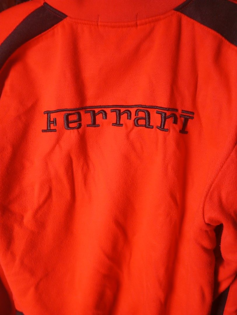 Ferrari Red Track Jacket (Category: Coats, Jackets and Outerwear) located in Manila. Submitted by kyedaee_ (Listing ID 1463769411, Image 2). Description: SIZE LARGE - Cool red Ferrari track jacket - Ferrari logo embroidered on the chest - Ferrari name embroidered on the back - Ribbed collar and cuffs for a comfortable fit - Size: Large (L) - Ideal for any passionate Ferrari enthusiast.