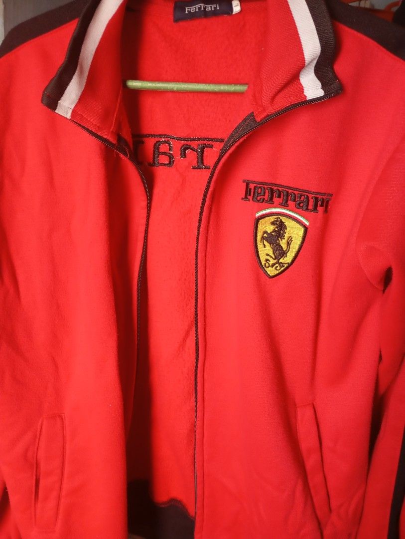 Ferrari Red Track Jacket (Category: Coats, Jackets and Outerwear) located in Manila. Submitted by kyedaee_ (Listing ID 1463769411, Image 1). Description: SIZE LARGE - Cool red Ferrari track jacket - Ferrari logo embroidered on the chest - Ferrari name embroidered on the back - Ribbed collar and cuffs for a comfortable fit - Size: Large (L) - Ideal for any passionate Ferrari enthusiast.