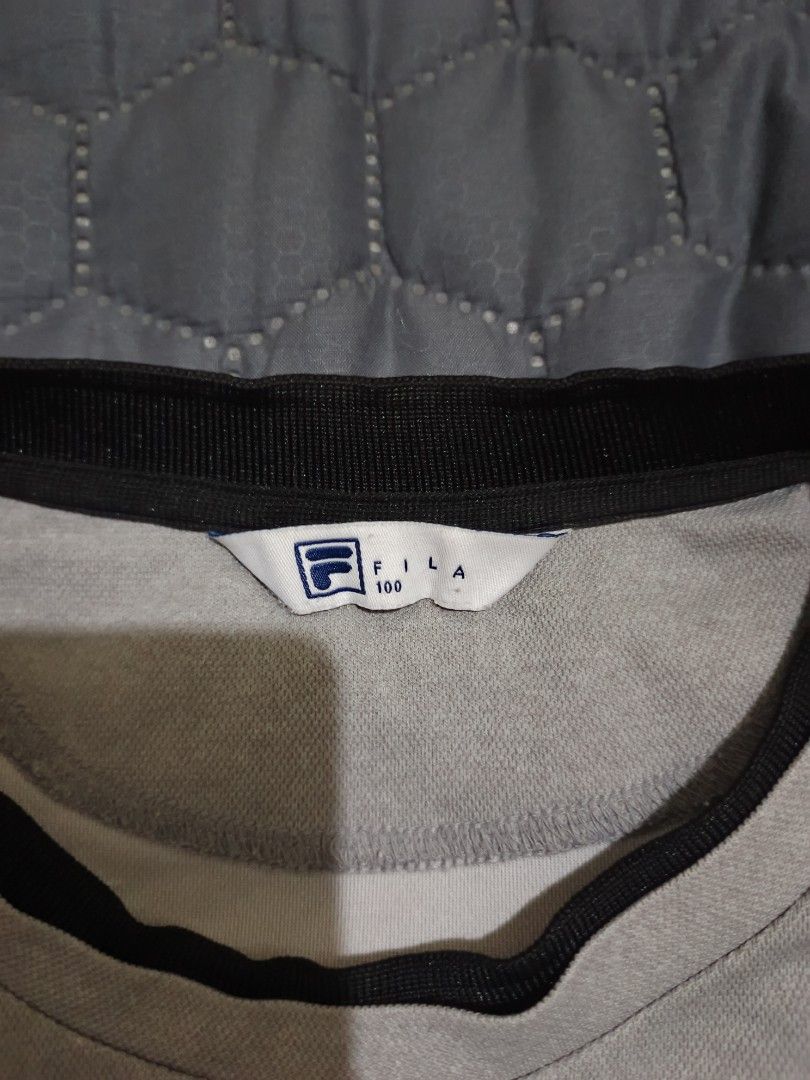 Fila Grey T-shirt (Category: Tshirts & Polo Shirts ) located in Davao. Submitted by jjj_mncd (Listing ID 1463875094, Image 3). Description: width: 21 length: 26 - Grey Fila T-shirt - Small Fila logo on front - Ribbed collar and sleeve cuffs - Suitable for sports or casual wear.