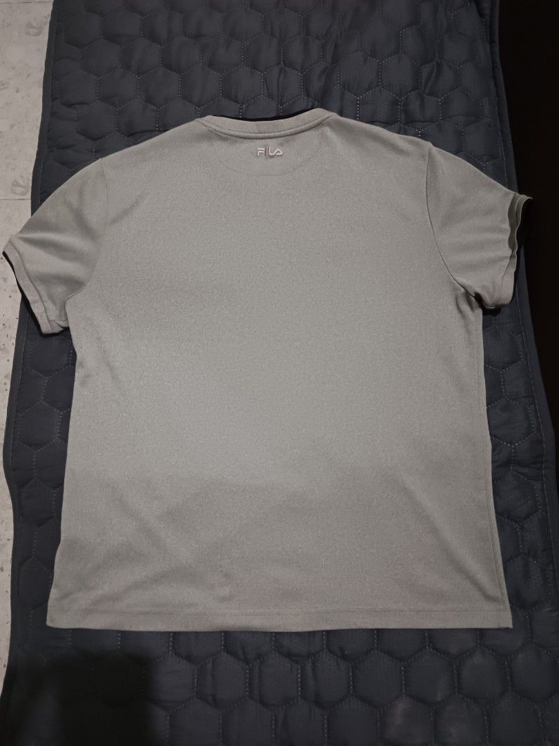 Fila Grey T-shirt (Category: Tshirts & Polo Shirts ) located in Davao. Submitted by jjj_mncd (Listing ID 1463875094, Image 2). Description: width: 21 length: 26 - Grey Fila T-shirt - Small Fila logo on front - Ribbed collar and sleeve cuffs - Suitable for sports or casual wear.